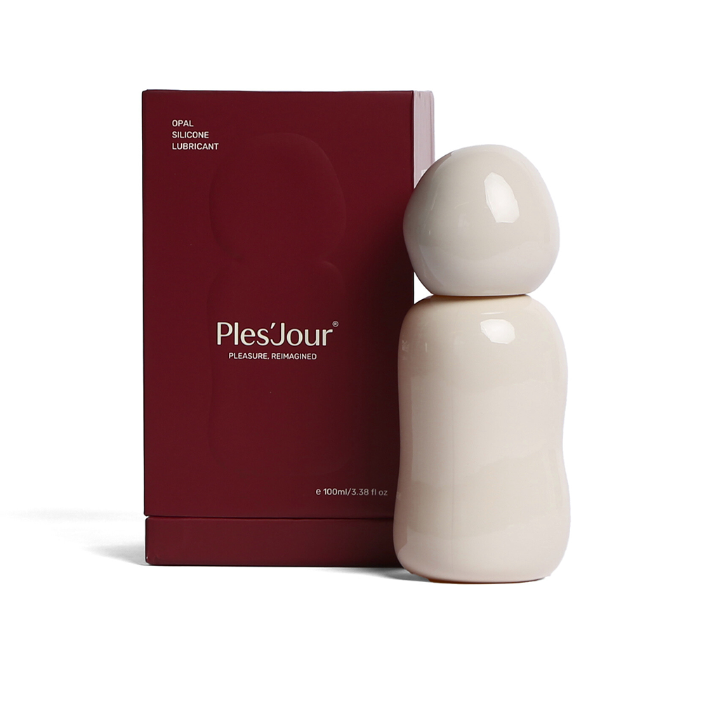Ples'Jour® Opal Silicone Lubricant in its sculptural glass bottle