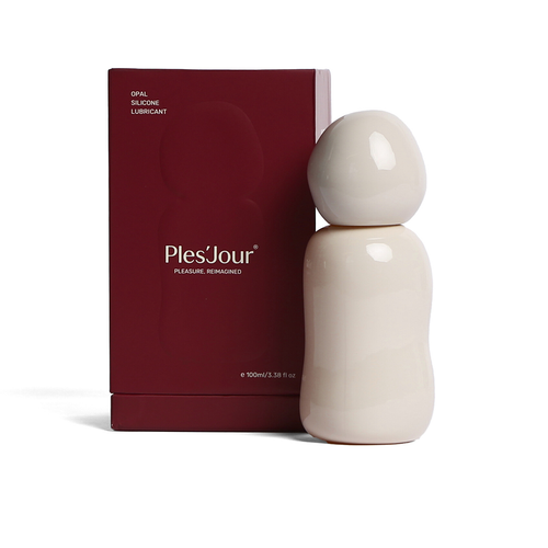Ples'Jour® Opal Silicone Lubricant in its sculptural glass bottle